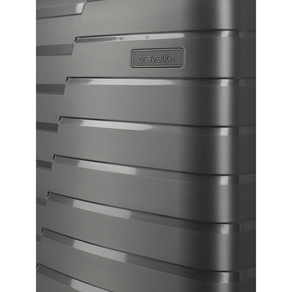Lieblingstasche Air Base Trolley 4W S exp in dark grey with a textured, ribbed hard-shell surface and travelite logo.