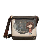 Lieblingstasche Anekke cross-body bag in brown with illustrated girl graphic, zip closure, and branded shoulder strap.