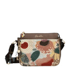 Lieblingstasche Anekke cross-body bag with floral embroidery, brown faux leather trim, and decorative metal charms.