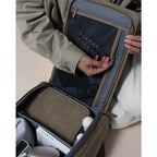 Lieblingstasche Bali Pro backpack interior with mesh pocket, organizer pouch, book, and accessories. Beige.