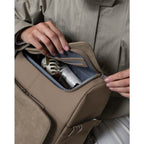 Lieblingstasche Bali Pro taupe toiletry bag with zipper closure, showing contents.