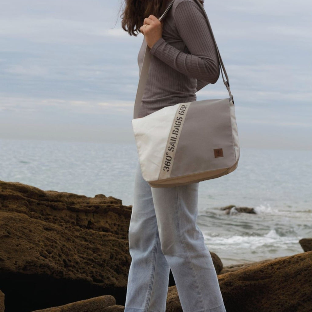 Lieblingstasche Barkasse shoulder bag made from recycled sailcloth with unique stitching and number detail on beach