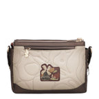 Lieblingstasche beige and brown cross-body bag with quilted texture, windmill patch, and gold zipper hardware