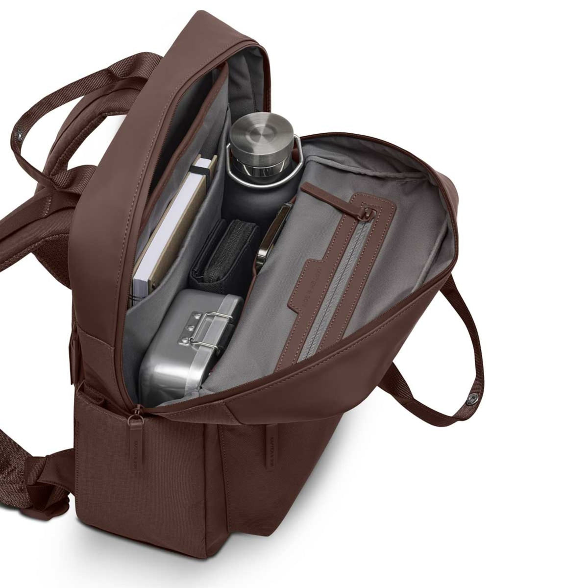 Lieblingstasche Bergen Pro brown backpack with open main compartment showing organized interior and water bottle