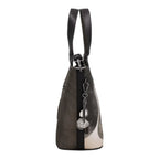 Lieblingstasche short handle bag in black and grey with a decorative metal charm, side view