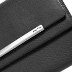 Lieblingstasche black leather clutch purse with silver metal bar detail and MAITRE logo