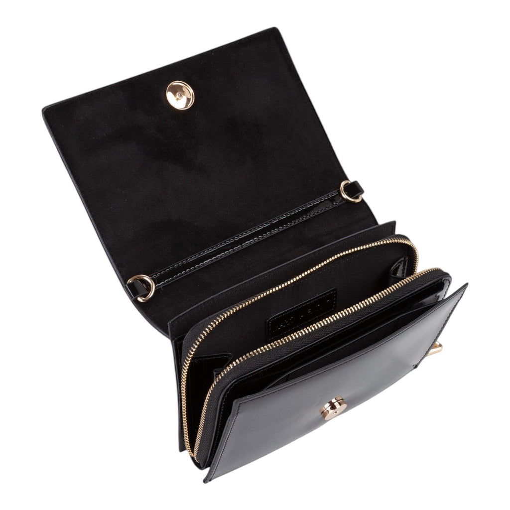 Lieblingstasche black leather flap bag with gold hardware and multiple zippered compartments.