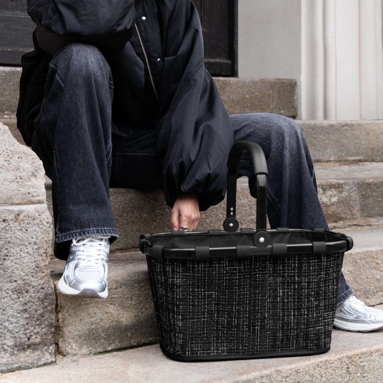 Lieblingstasche black woven carrybag with black handles, a stylish and practical accessory.