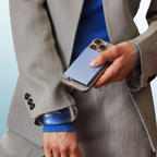 Lieblingstasche blue fluted MagSafe card protector attached to a smartphone held by a person in a grey suit