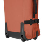 Lieblingstasche BOLONIA S rolling travel bag in burnt orange fabric with black wheels and straps.