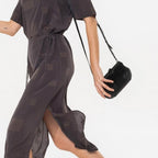 Lieblingstasche Mrs. Whoopie Pie brown midi dress with geometric pattern, short sleeves, and side slit on a model.