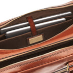 Lieblingstasche brown leather briefcase interior with two tablets secured by a leather strap.