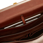 Lieblingstasche brown leather briefcase interior with a tablet secured by a leather strap.