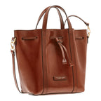 Lieblingstasche brown leather bucket bag with drawstring closure and top handles.