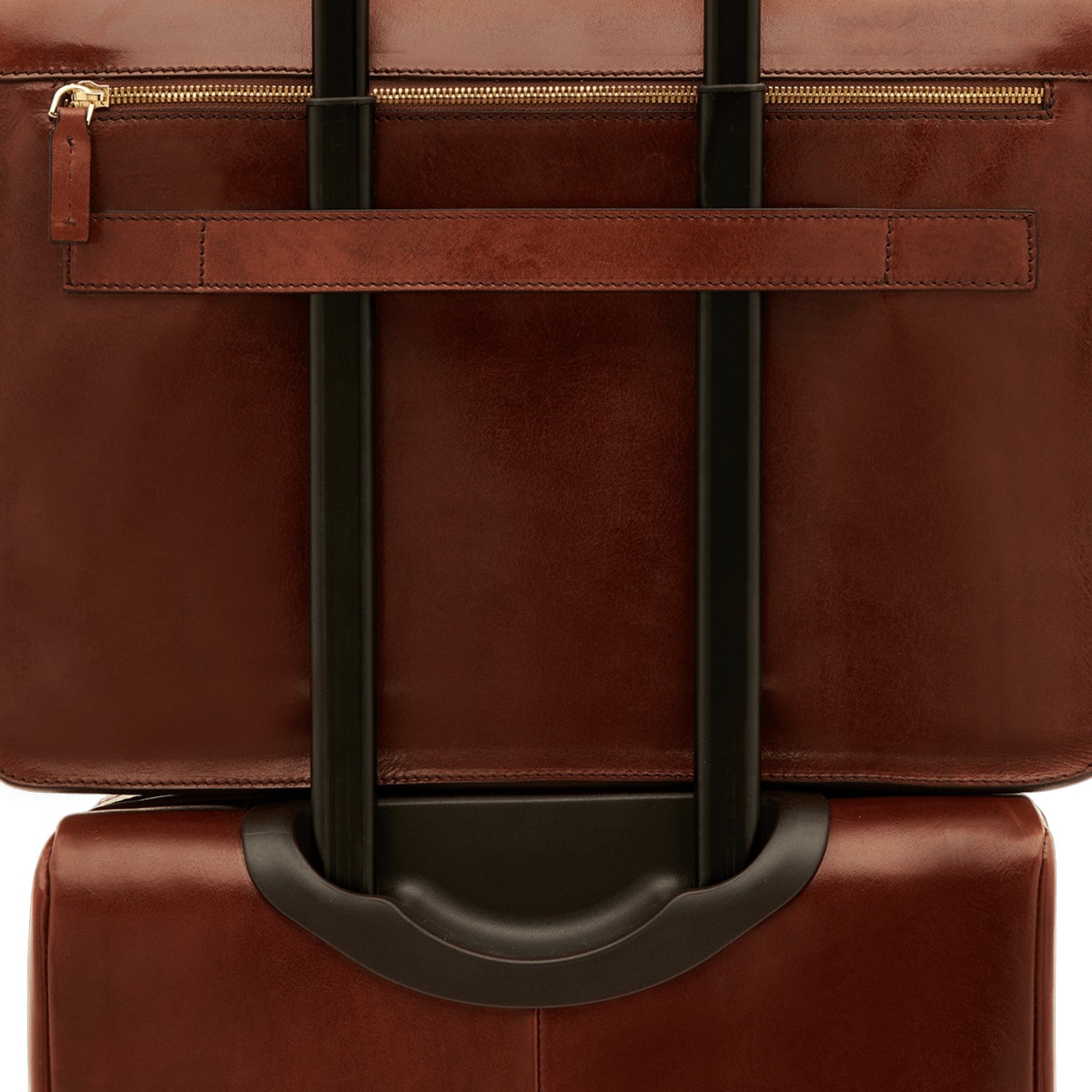 Lieblingstasche brown leather business bag with gold zipper detail and luggage strap