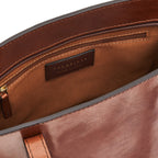 Lieblingstasche brown leather tote bag interior with zip pocket and brand logo detail.
