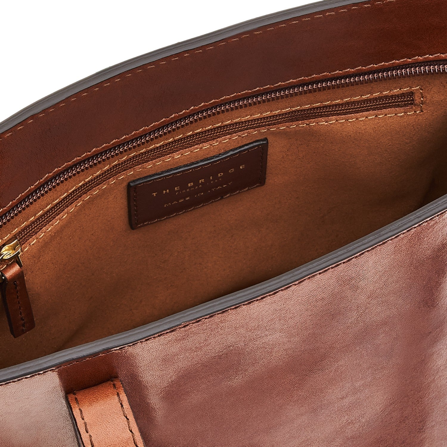 Lieblingstasche brown leather tote bag interior with zip pocket and brand logo detail.