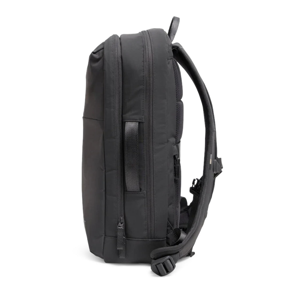 Lieblingstasche Commuter Pack in black, side view showing padded straps and carry handle for professional travel.