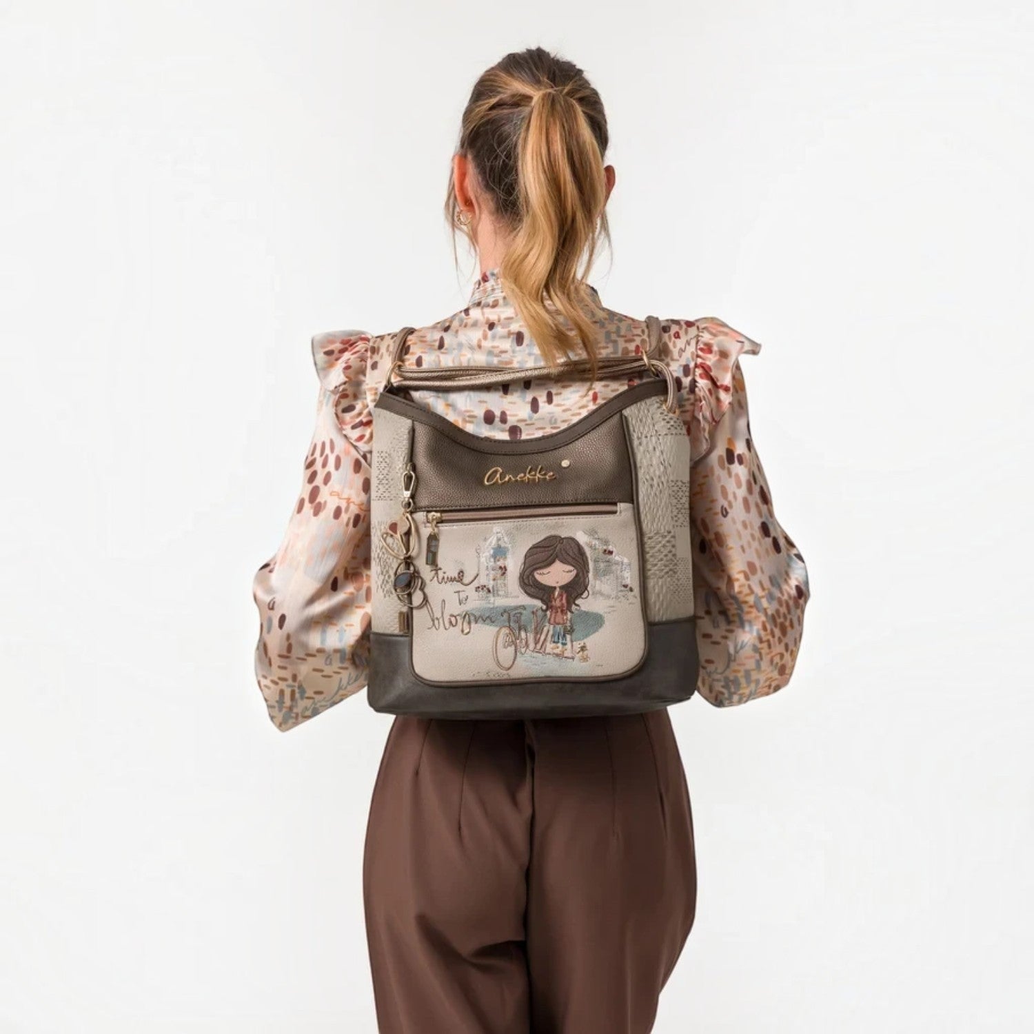 Lieblingstasche convertible backpack with Anekke illustration, featuring brown and beige faux leather details.