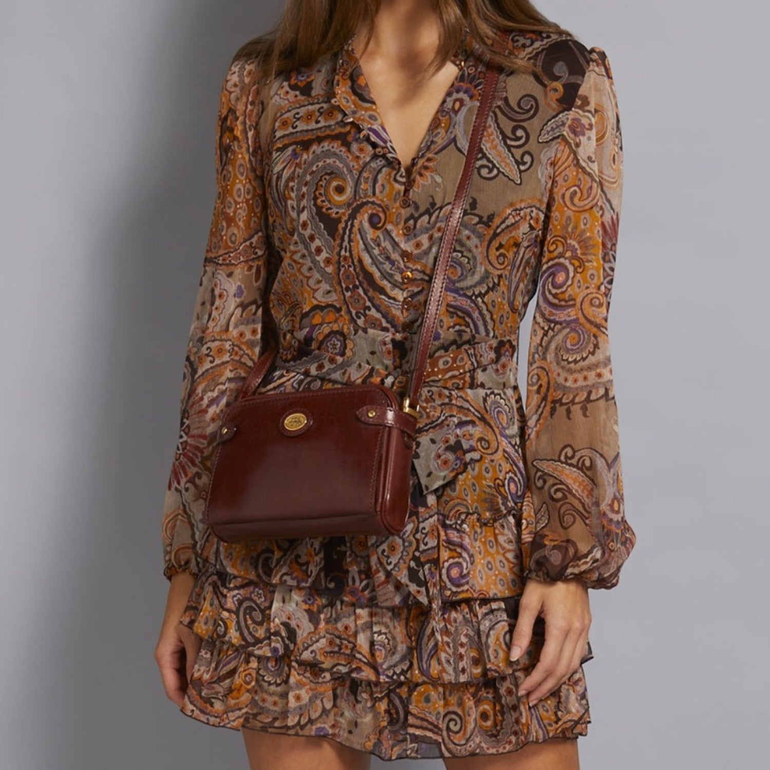 Lieblingstasche women's dark red leather crossbody bag with gold hardware and adjustable strap.