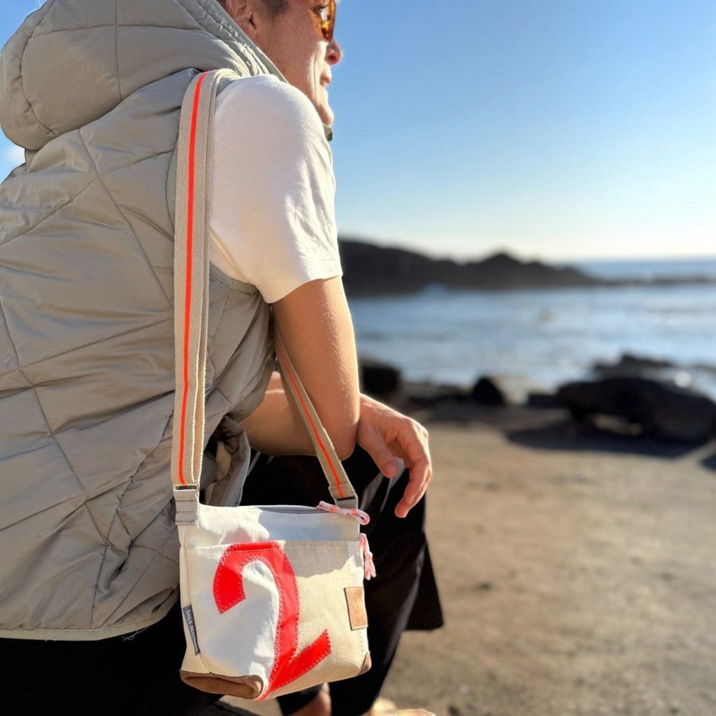 Lieblingstasche Deern Lütt crossbody bag in white canvas with a red number 2 and orange striped shoulder strap