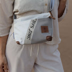 Lieblingstasche Deern Lütt crossbody bag made from recycled white and grey sailcloth with brown leather accents