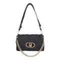 Lieblingstasche Crossbody M bag in dark denim with quilted pattern, faux fur trim, and gold-tone chain strap.