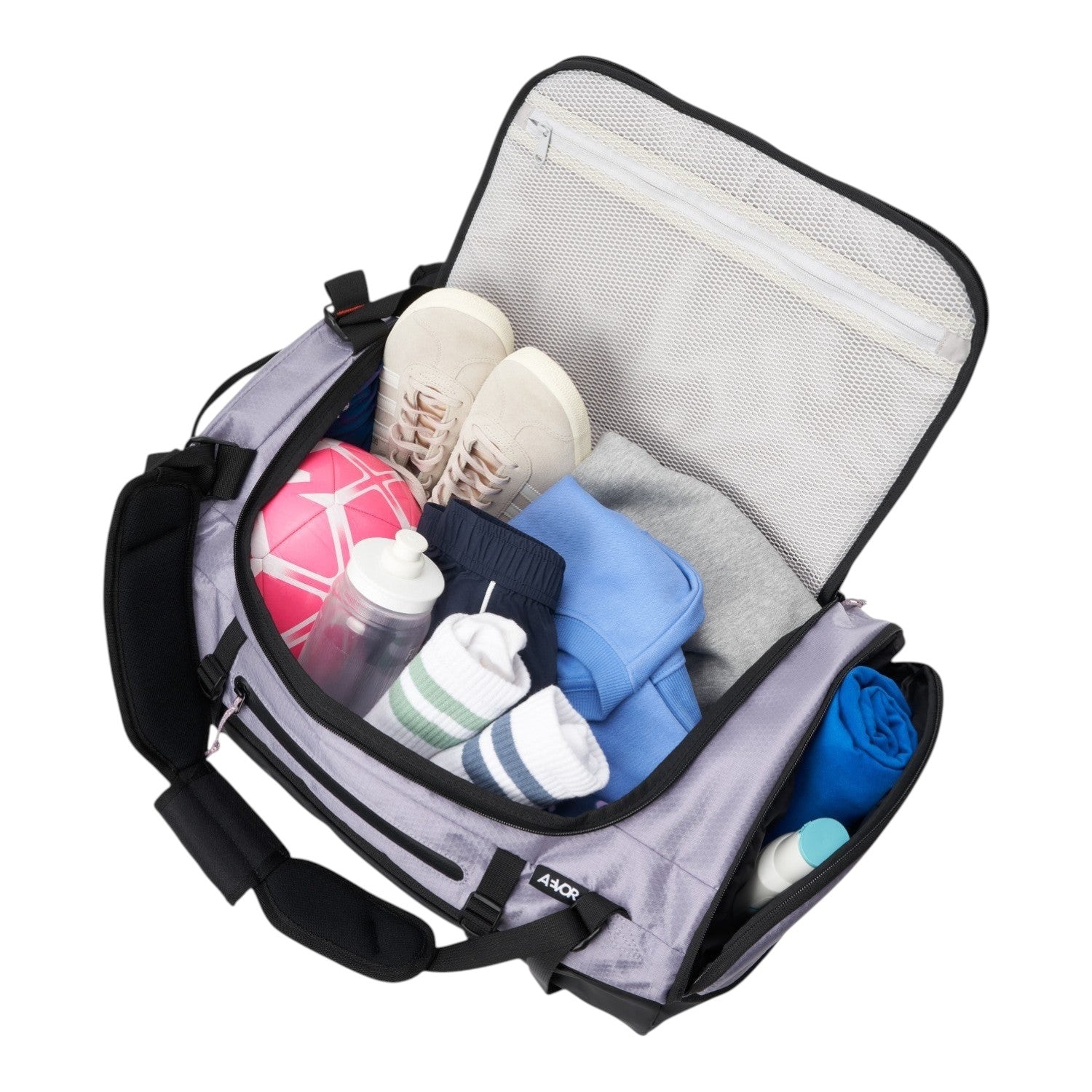 Lieblingstasche Duffel Pack in light grey, open and packed with gym clothes, sneakers, and a water bottle
