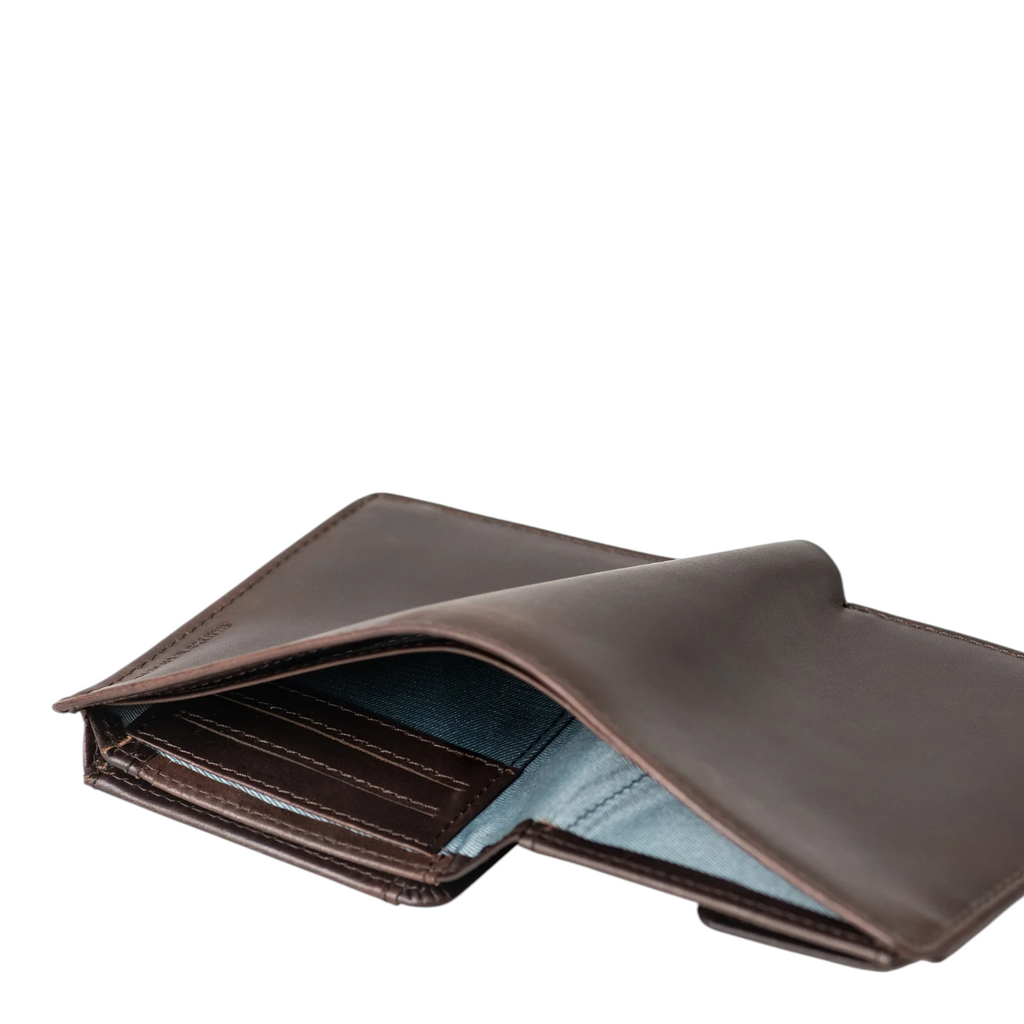 Lieblingstasche Duke brown leather wallet with blue fabric lining, shown from an open angle.