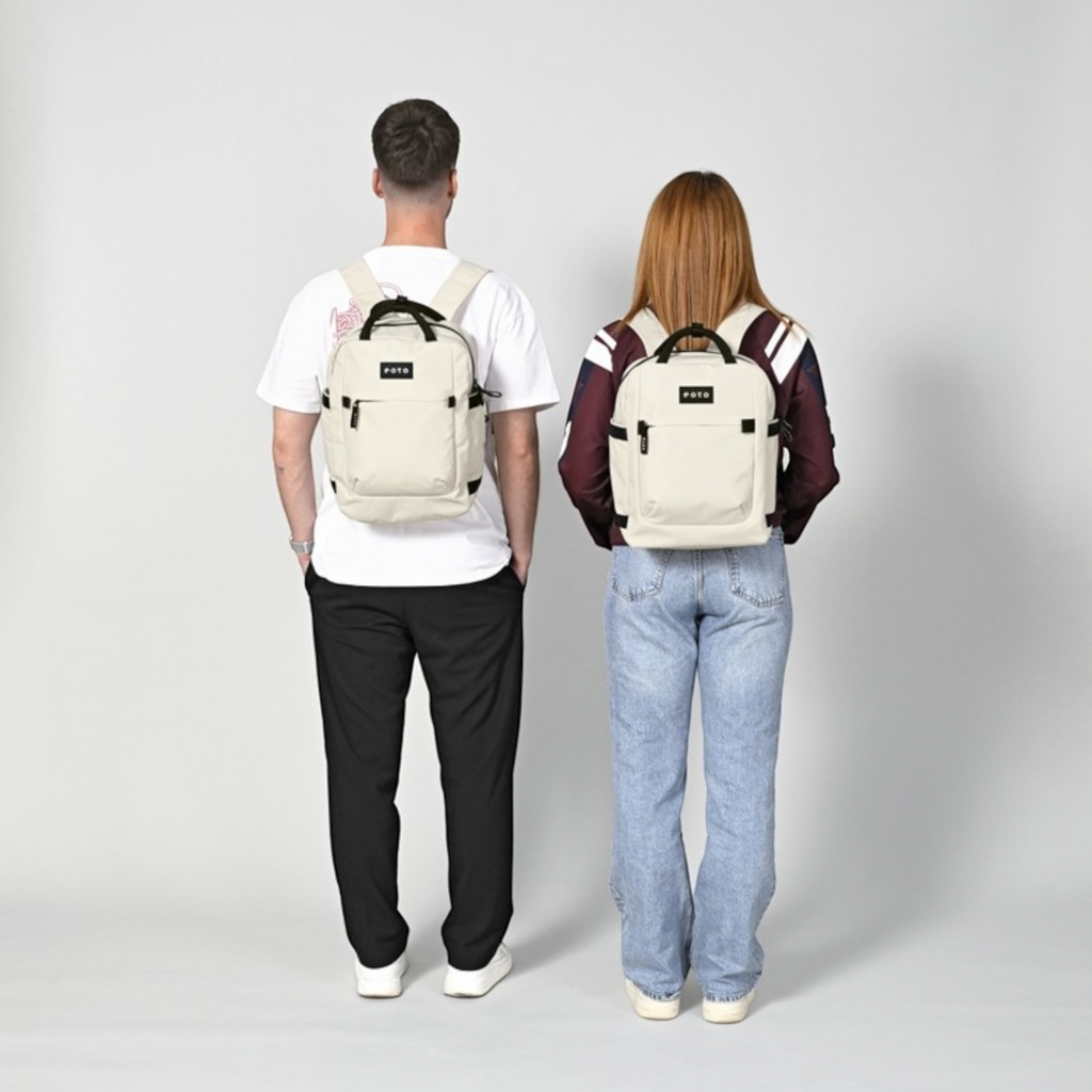 Lieblingstasche eoto Small16 beige daypack worn by a man and woman, showing compact design and black accents