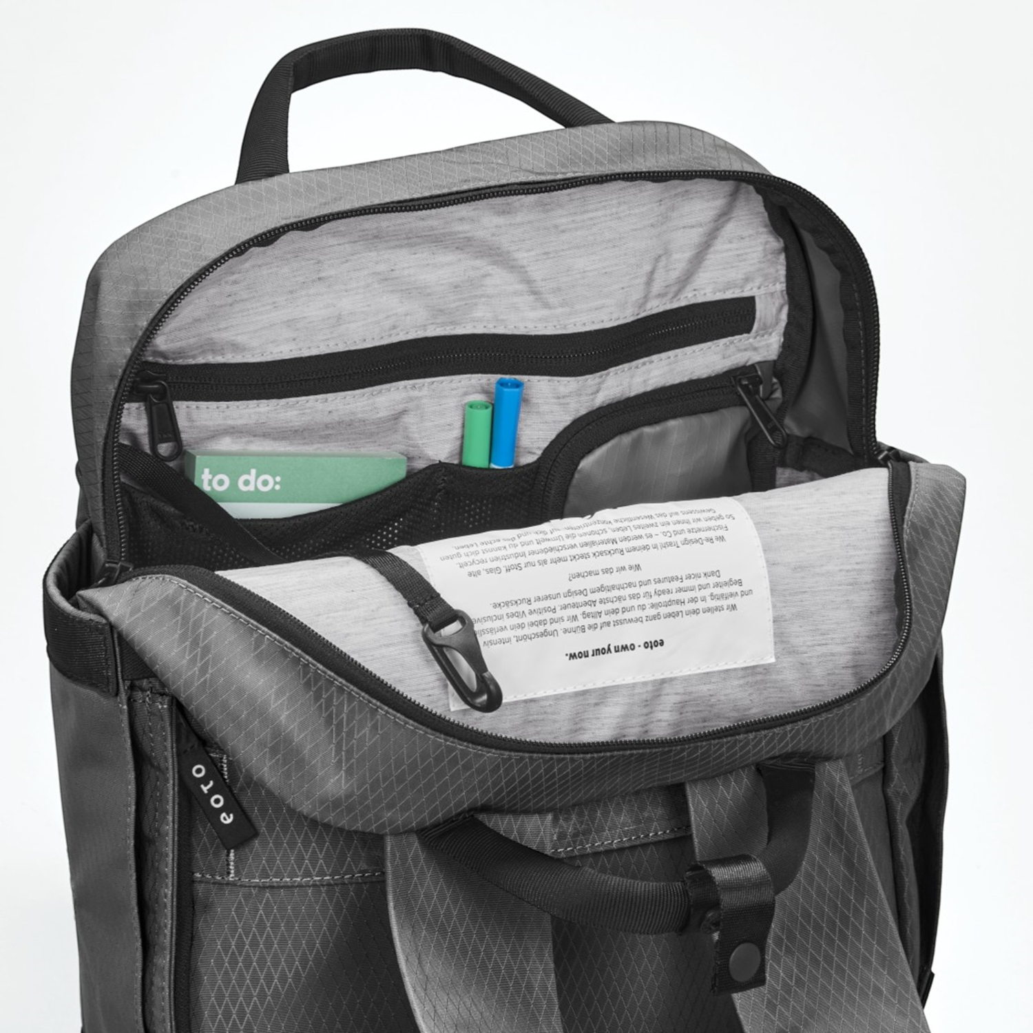 Lieblingstasche eoto Small16 grey daypack with open main compartment showing internal organizer pockets and key hook