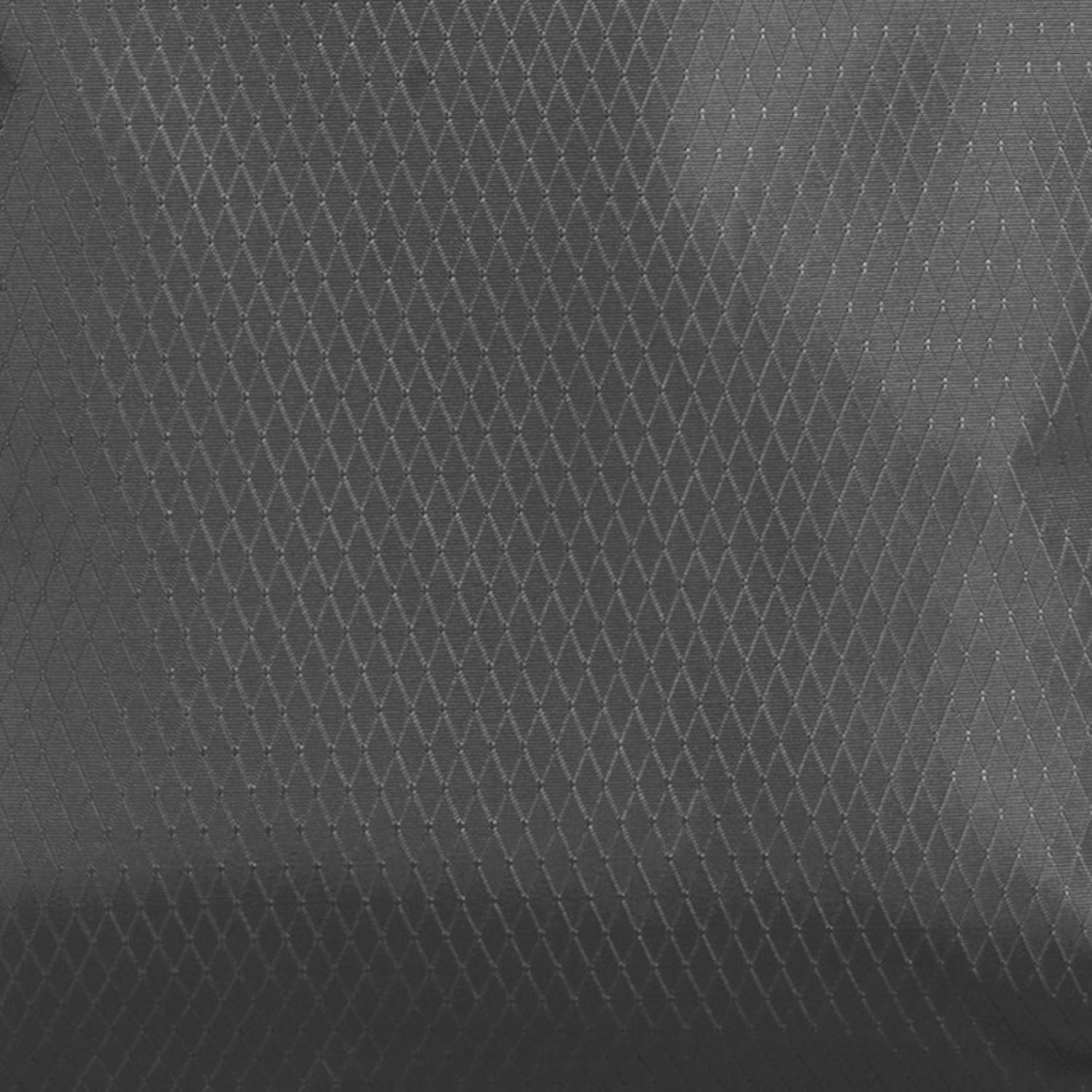 Close-up of the grey diamond-patterned water-resistant fabric used on the Lieblingstasche eoto Small16 daypack.