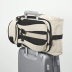 Lieblingstasche eoto Tall41 beige rolltop travel backpack with trolley sleeve attached to a suitcase handle