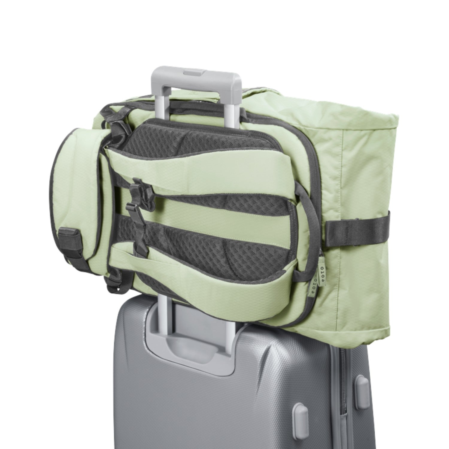 Lieblingstasche eoto Tall41 light green rolltop travel backpack with trolley sleeve attached to a suitcase