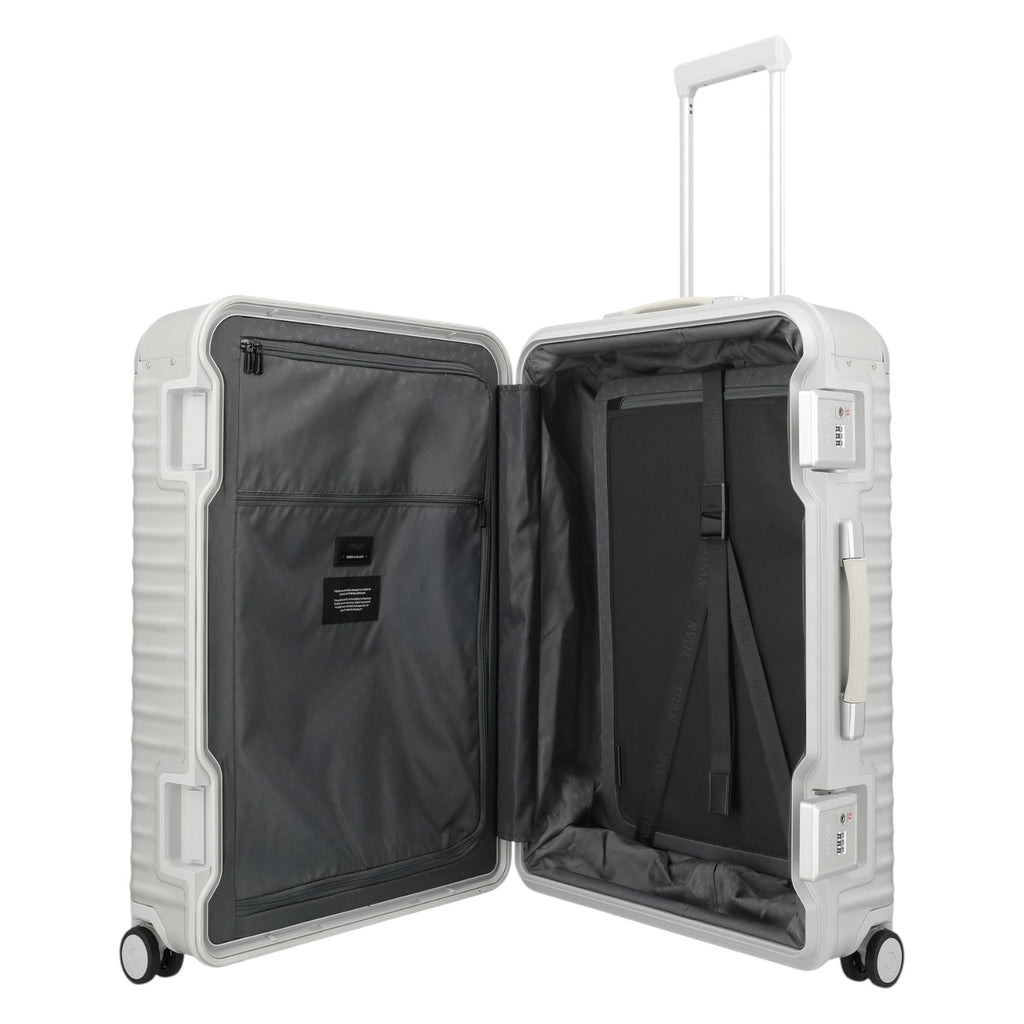 Lieblingstasche Eternity 4W Trolley L, a large silver aluminum suitcase with a plastic frame, leather handles, and TSA locks. Open to show grey interior with straps.