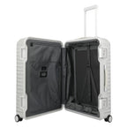 Lieblingstasche Eternity 4W Trolley L, a large silver aluminum suitcase with a plastic frame, leather handles, and TSA locks. Open to show grey interior with straps.
