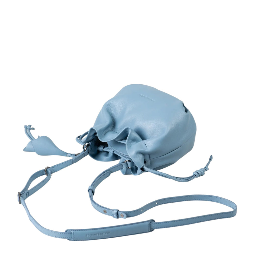 Lieblingstasche Fleur light blue leather bucket bag with a drawstring closure and adjustable shoulder strap.