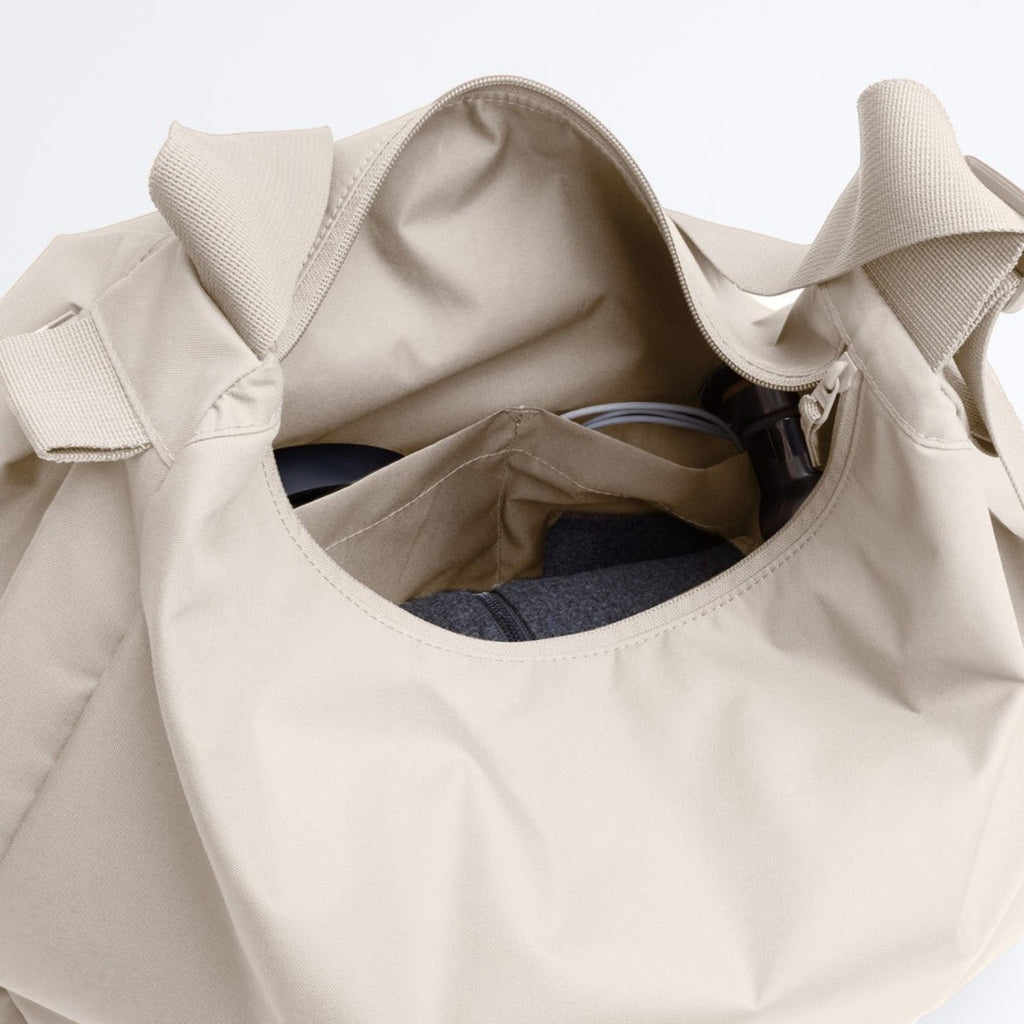 Lieblingstasche GOT BAG beige curved bag interior view with storage pockets and spacious main compartment