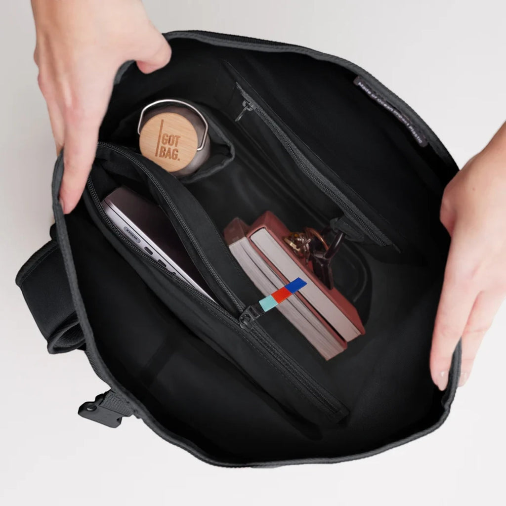 Lieblingstasche GOT BAG Rolltop Lite 2.0 interior view showing laptop sleeve, water bottle, and organized compartments