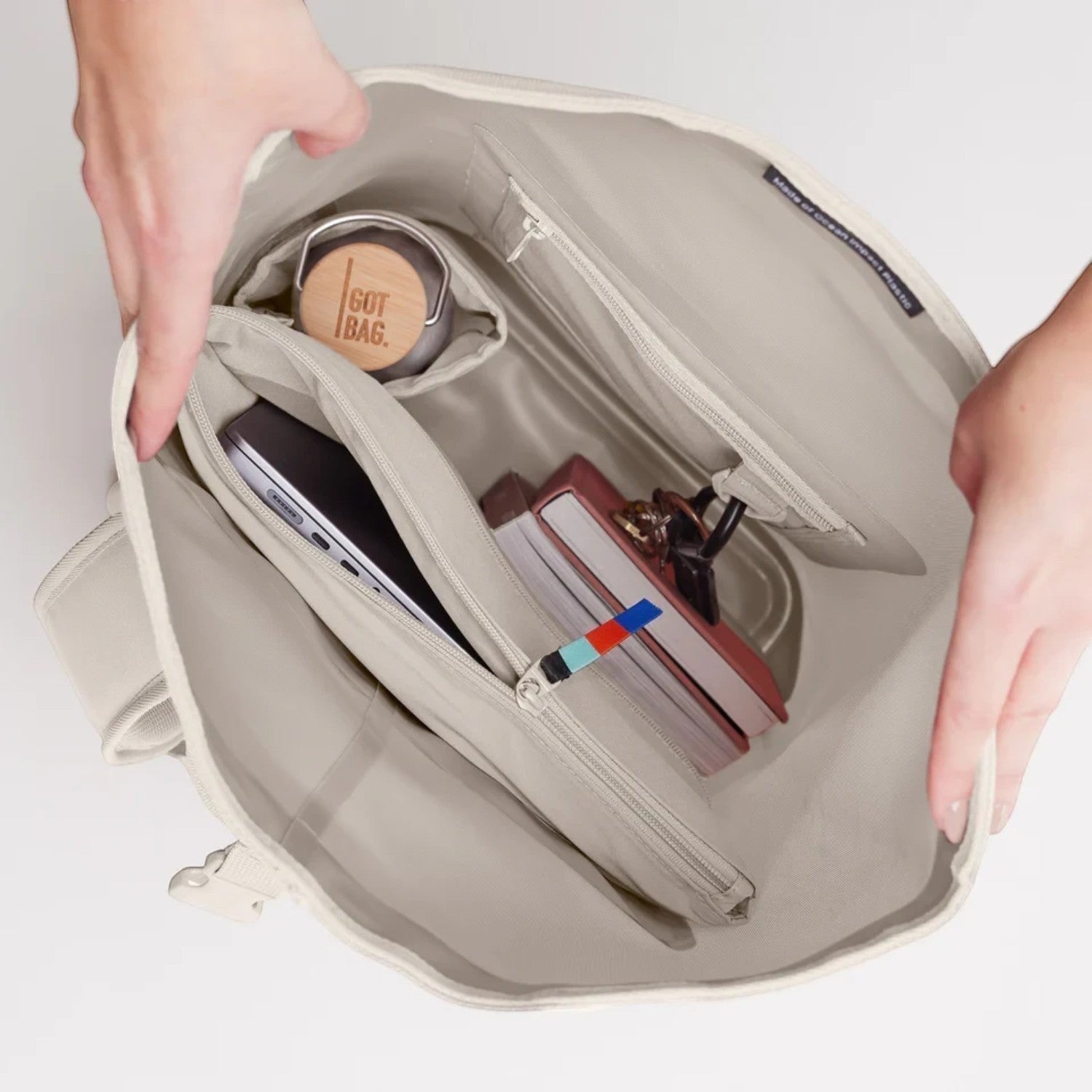 Lieblingstasche GOT BAG Rolltop Lite 2.0 backpack interior showing laptop sleeve, water bottle, and organized pockets