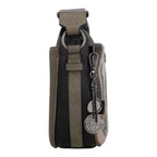 Side view of a Lieblingstasche cross-body bag in grey and black with decorative metal charms and adjustable strap