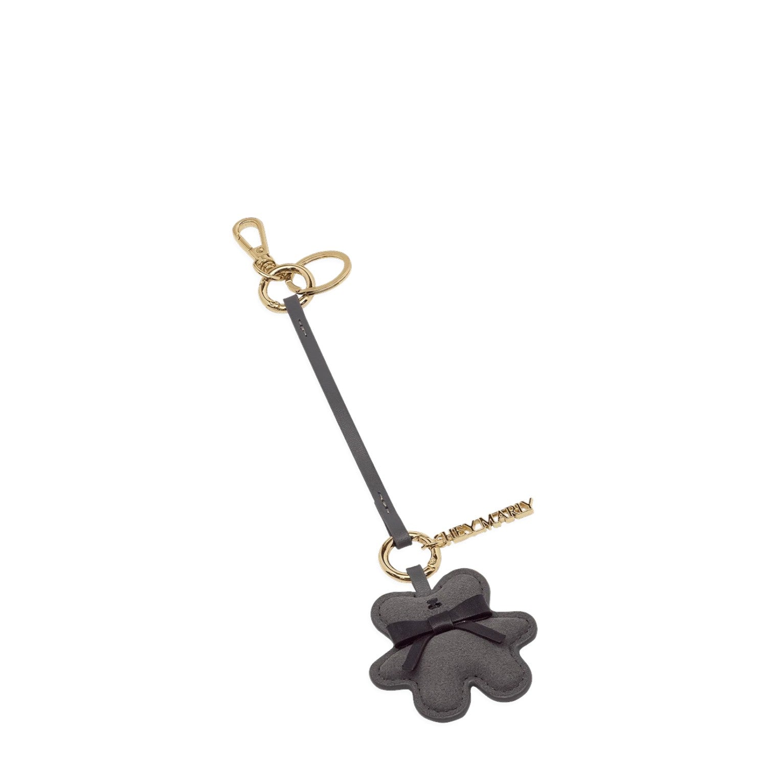 Lieblingstasche Teddy Charm in grey leather with a black bow, gold hardware, and a branded metal tag.