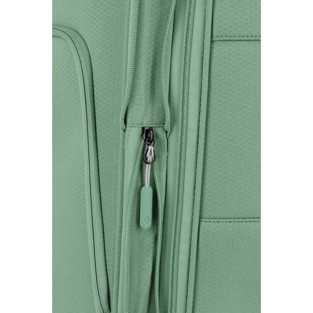 Close-up of the sage green Lieblingstasche Kick Off trolley suitcase featuring a textured fabric and zipper detail.