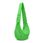 Lieblingstasche large green Moon Bag with a ruffled shoulder strap and minimalist design on a black background