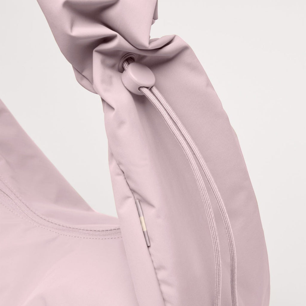 Lieblingstasche large Moon Bag in soft pastel pink with a gathered ruffle handle and adjustable drawstring detail.