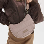Lieblingstasche Lifetime Buddy S quilted crescent crossbody bag in taupe with adjustable strap