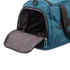 Lieblingstasche Lightstyler Duffle L in teal with a black zippered side compartment and patterned interior lining