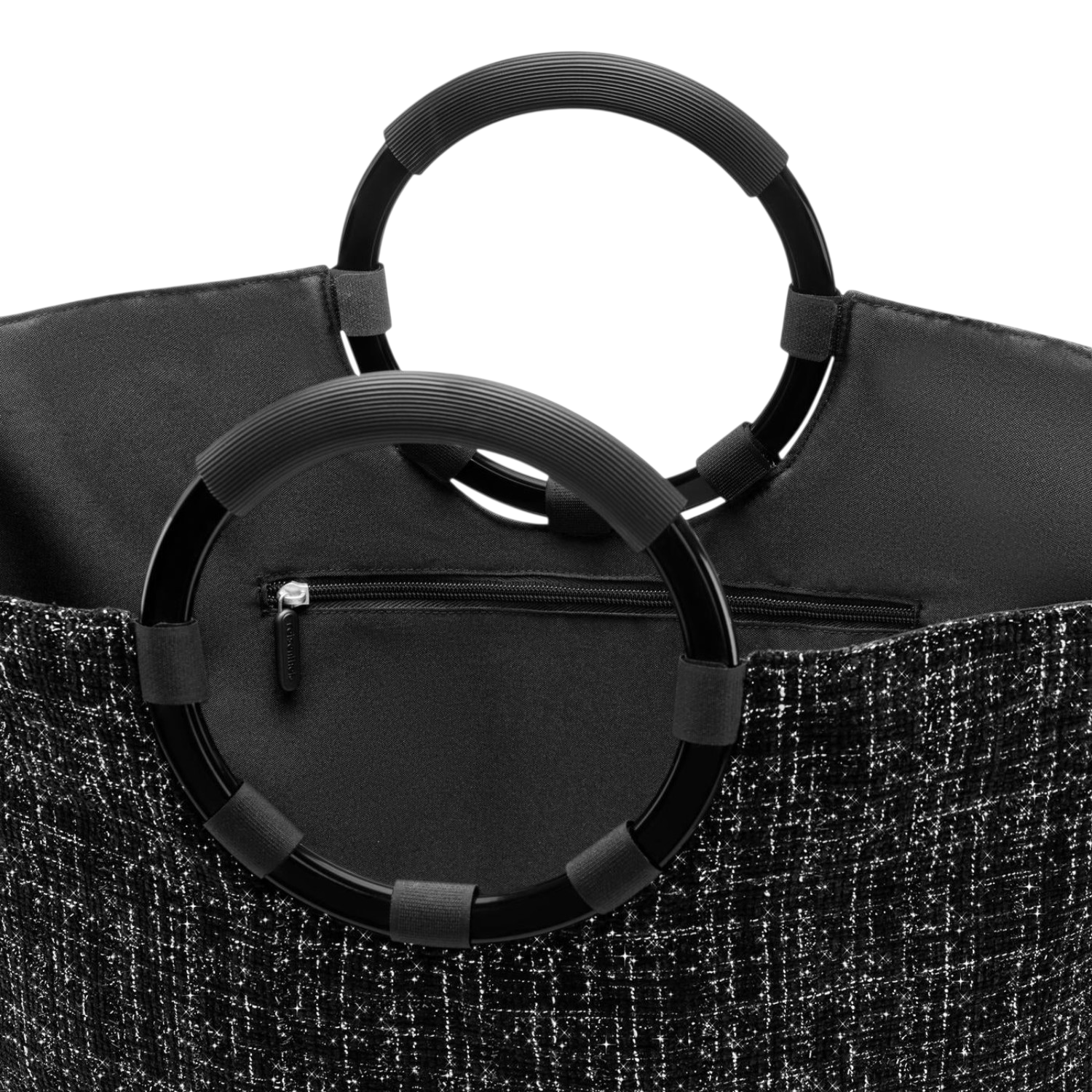 Lieblingstasche Loopbag Hobo featuring a black textured fabric exterior and distinctive circular ring handles.