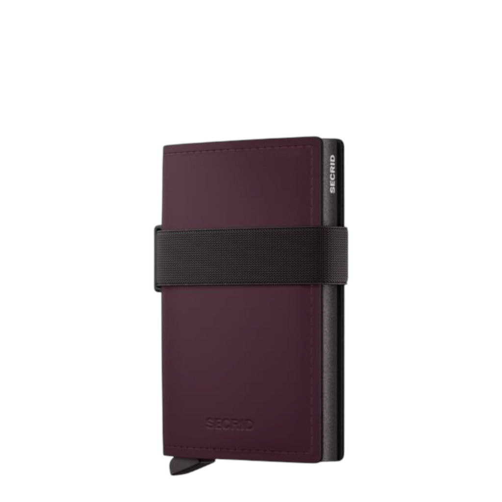 Lieblingstasche Bandwallet Matte in dark purple with a black elastic strap and integrated card protector mechanism