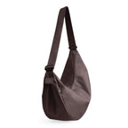 Lieblingstasche Moon Bag Large in dark brown featuring a crescent-shaped silhouette and adjustable shoulder strap.